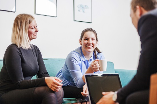 people sitting relaxation room smiling